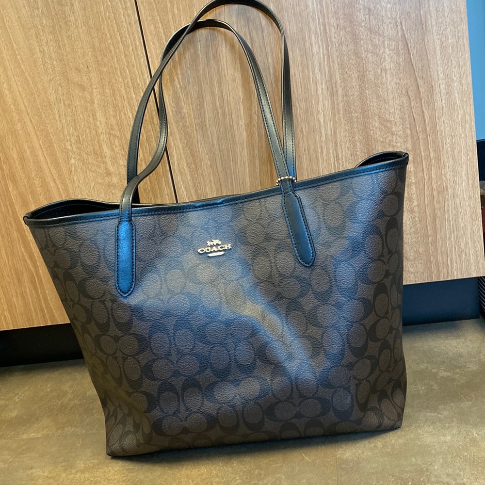 Like new brown and black leather coach tote. Carried for a very short time!
